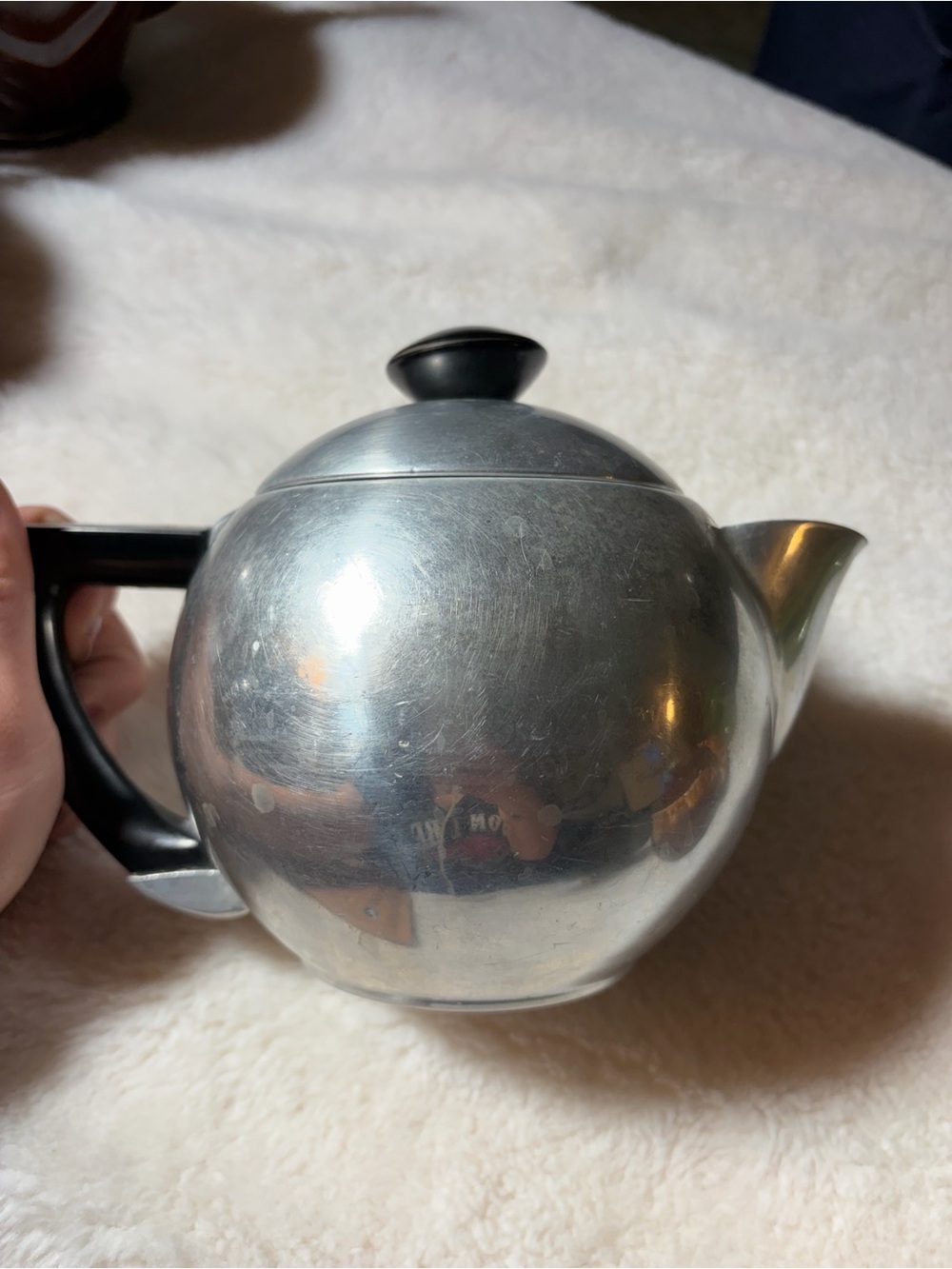 Polished Stainless Steel Teapot with Black Handle and Knob